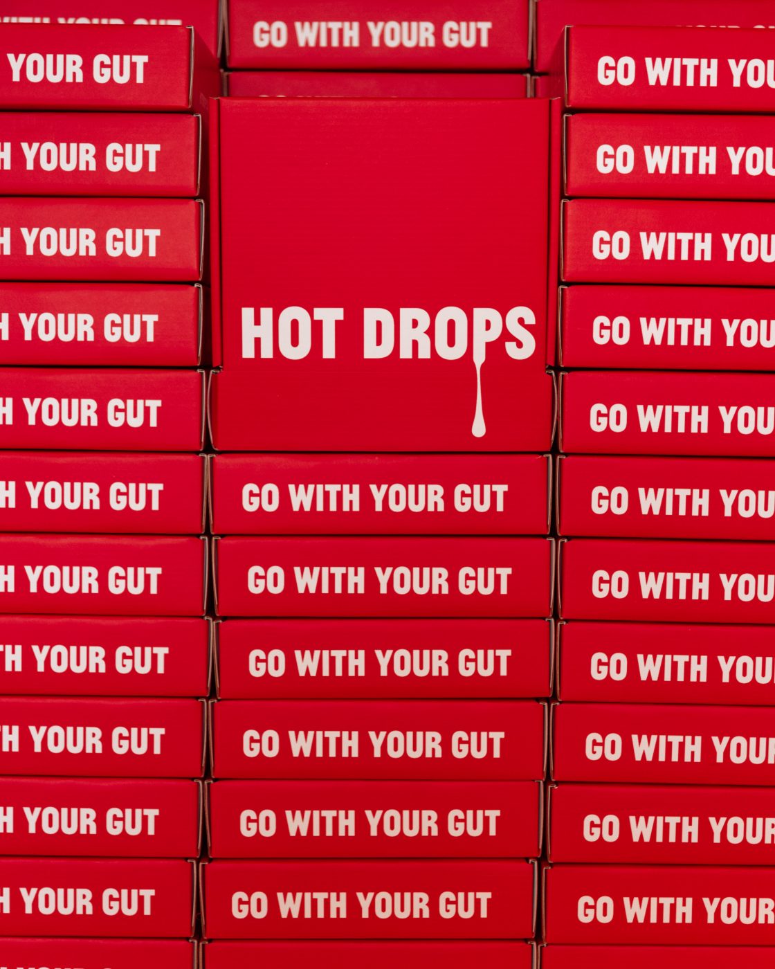Printed mailers stacked, “go with your gut” on every side panel
