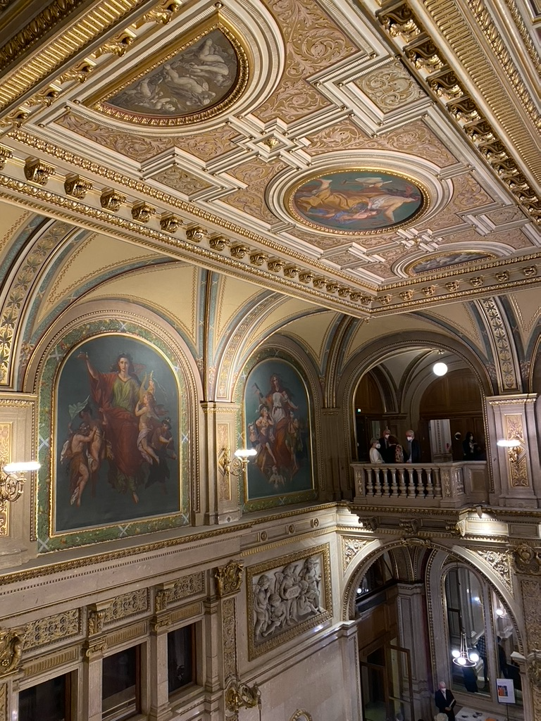 Gilt and painted panels above the landing
