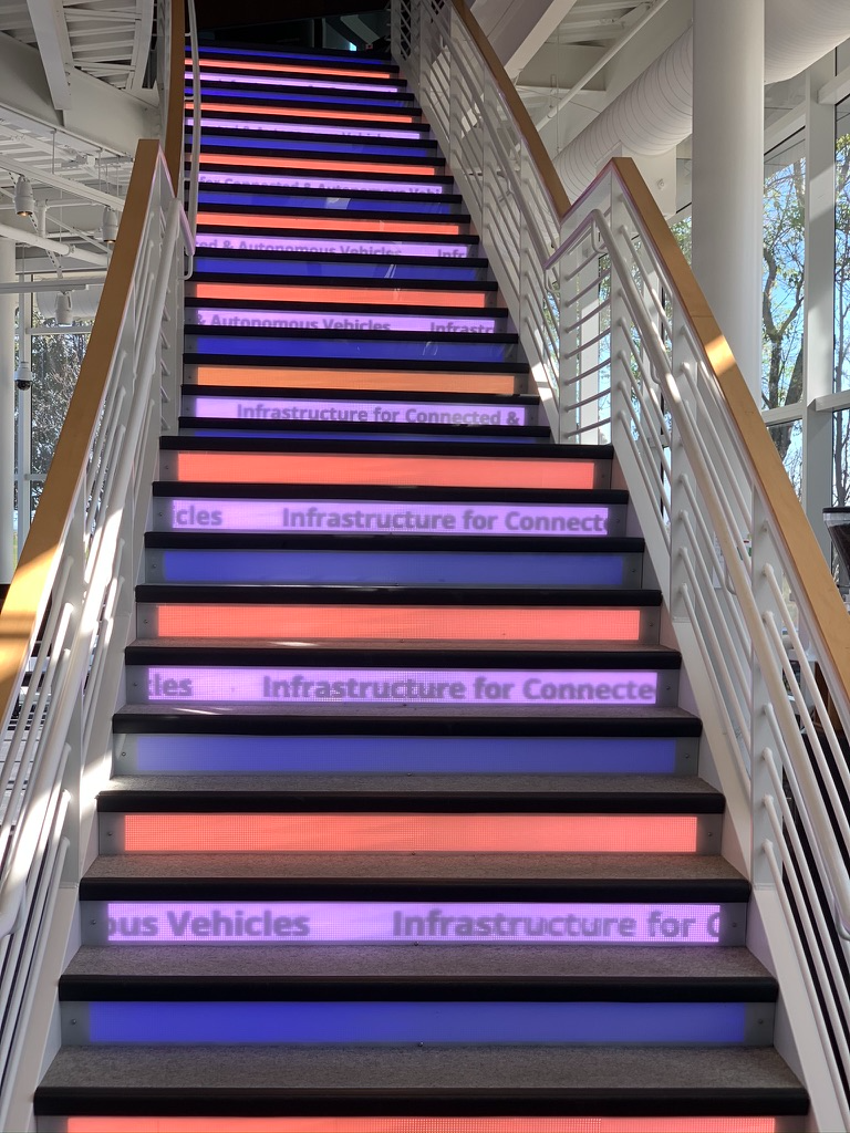 Environmental graphics running up the stair risers
